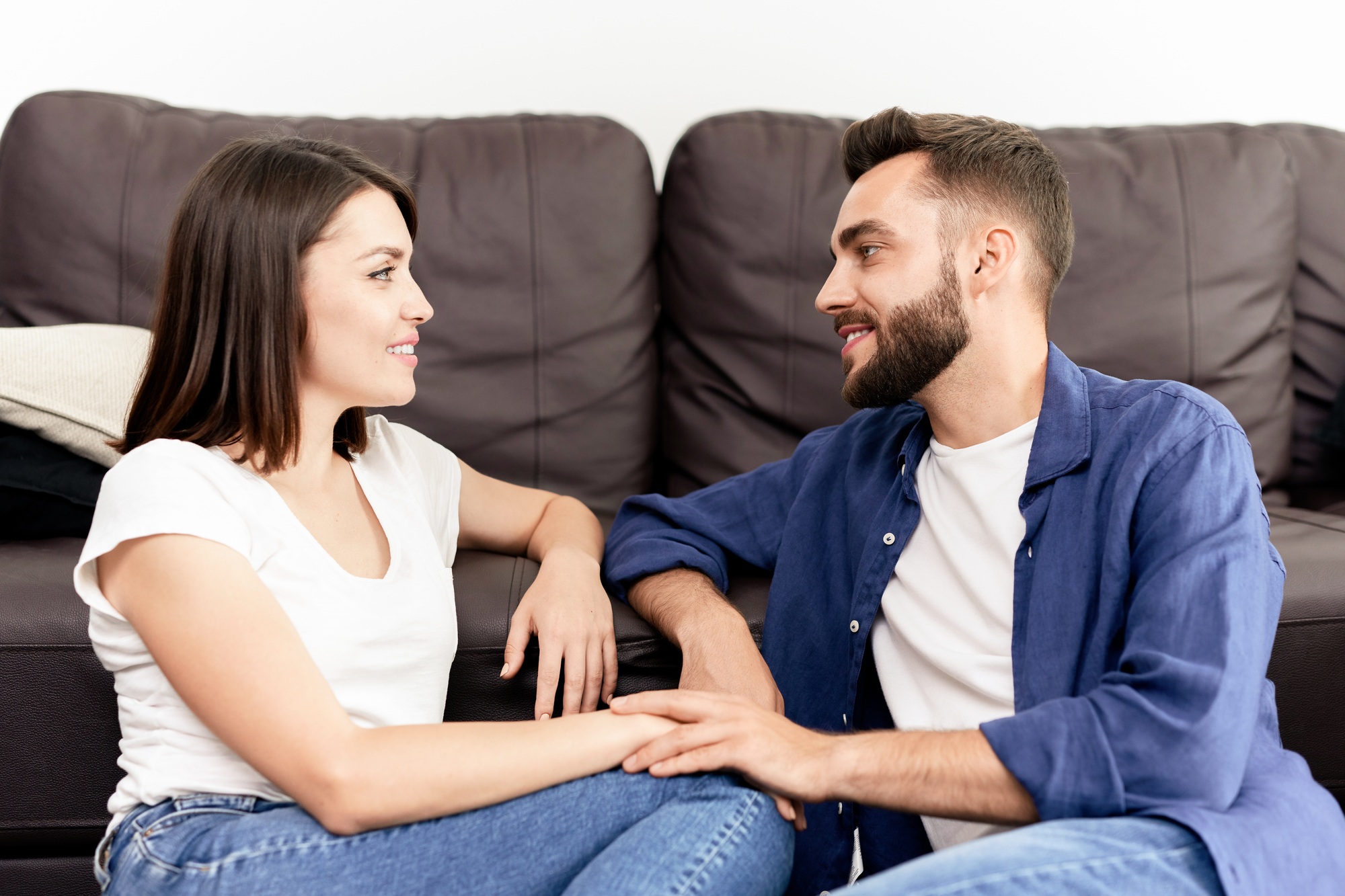 Couple chatting with each other at home