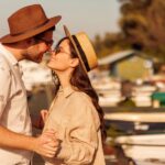 Couple kissing while spending hot summer day by the river